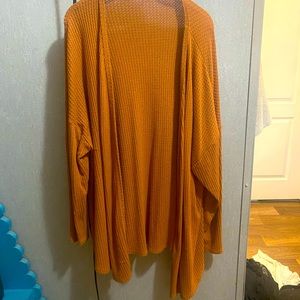 Mustard orange cardigan. Lightly worn.